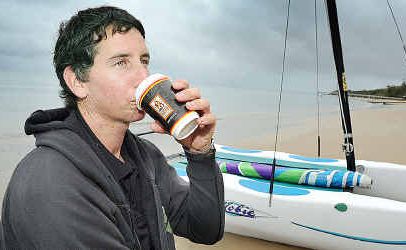 Aaron Ross sips a hot drink to keep warm on the beach at Torquay but warmer weather is on the way this weekend. Aaron Ross sips a hot drink to keep warm on the beach at Torquay but warmer weather is on the way this weekend.